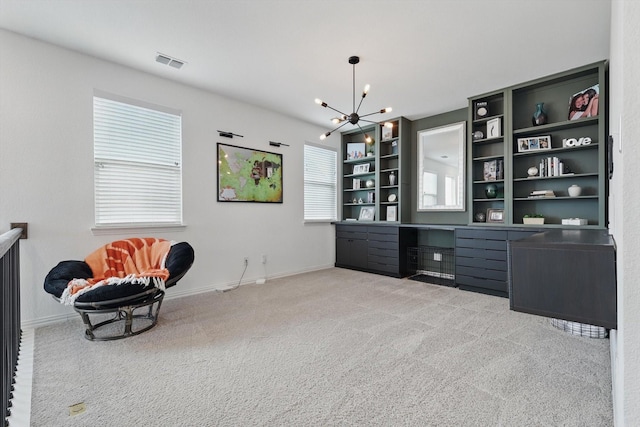 sitting room featuring light carpet, visible vents, baseboards, and an inviting chandelier