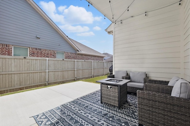 view of patio featuring an outdoor living space with a fire pit and fence