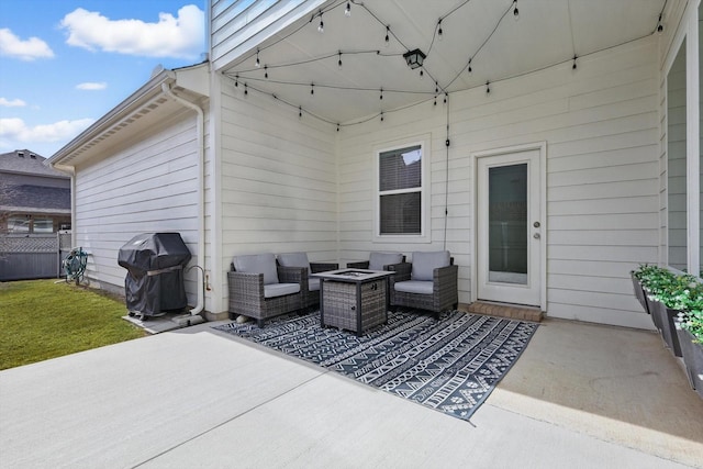 view of patio / terrace with grilling area and fence