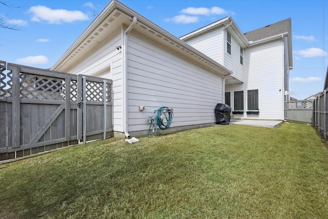 view of property exterior featuring a fenced backyard, a patio, a yard, and a gate