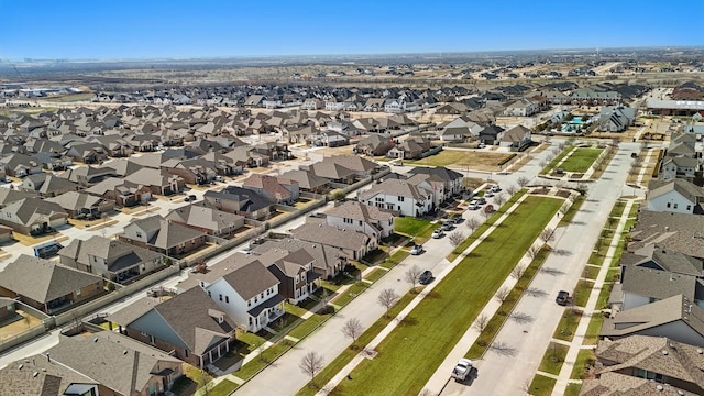 birds eye view of property with a residential view