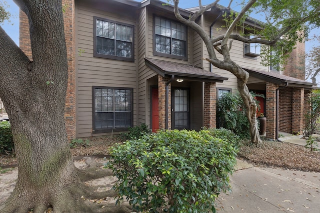 view of front of home with brick siding