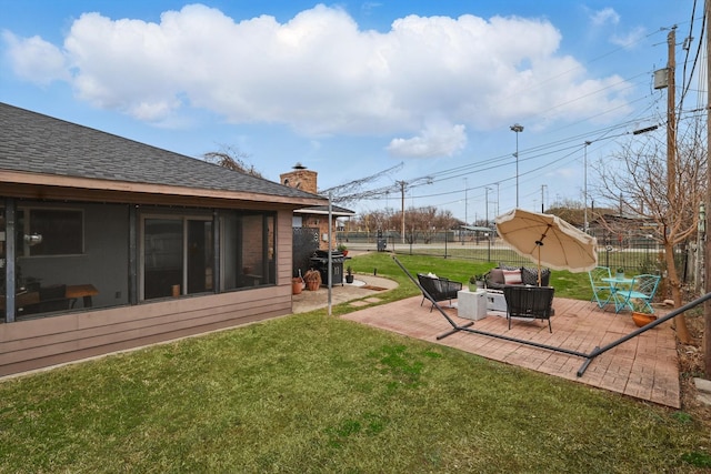 view of yard featuring a patio and fence