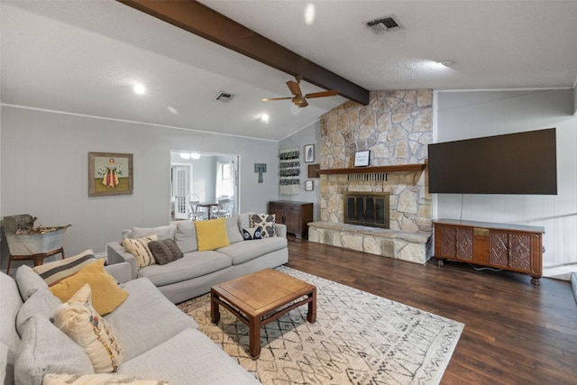 living area featuring visible vents, lofted ceiling with beams, a ceiling fan, and wood finished floors