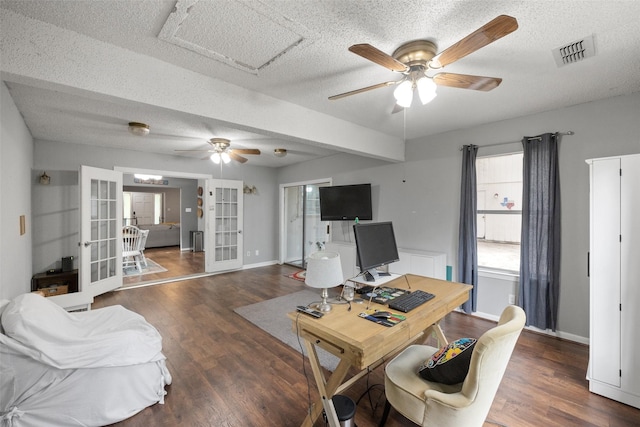 office space featuring a ceiling fan, wood finished floors, french doors, and visible vents