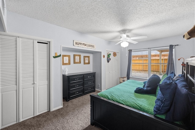 carpeted bedroom featuring a closet, baseboards, a textured ceiling, and ceiling fan