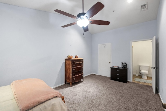 bedroom with baseboards, visible vents, carpet floors, and connected bathroom