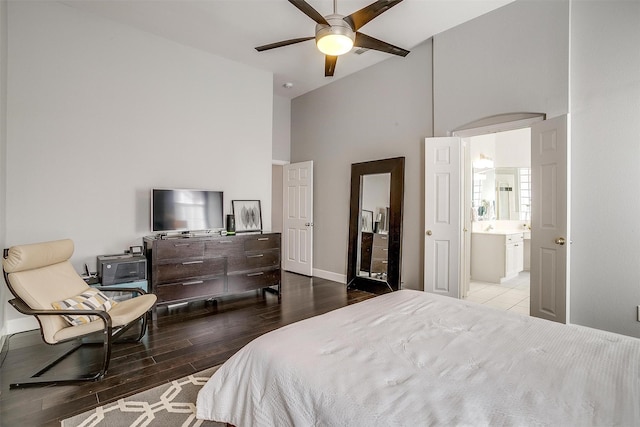 bedroom featuring ceiling fan, high vaulted ceiling, and wood finished floors