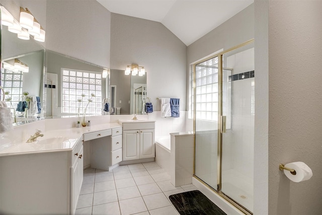 full bathroom with a wealth of natural light, lofted ceiling, a stall shower, and tile patterned floors