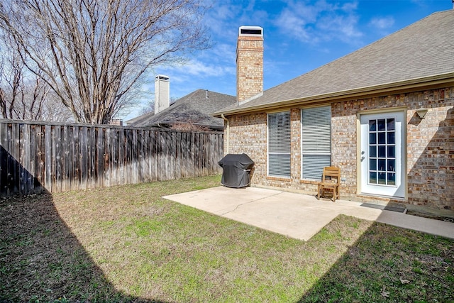 view of yard featuring a patio and fence