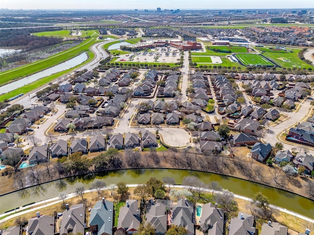 aerial view with a residential view and a water view