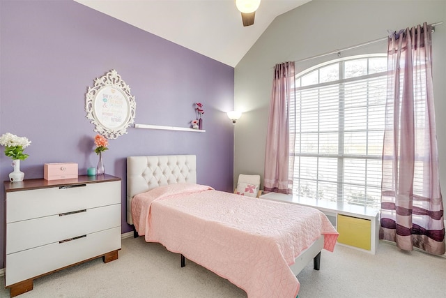 bedroom featuring light carpet, ceiling fan, and vaulted ceiling