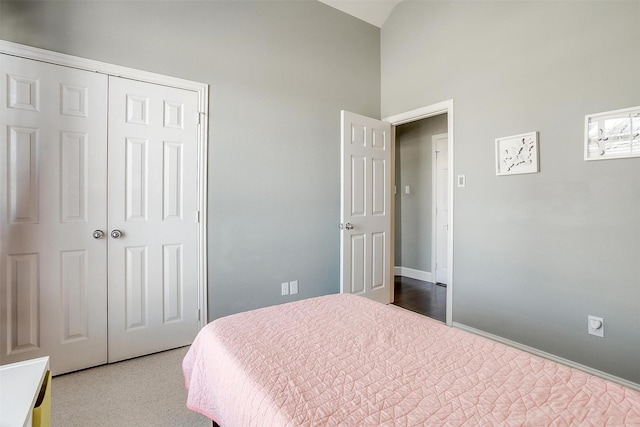 bedroom featuring baseboards and a closet