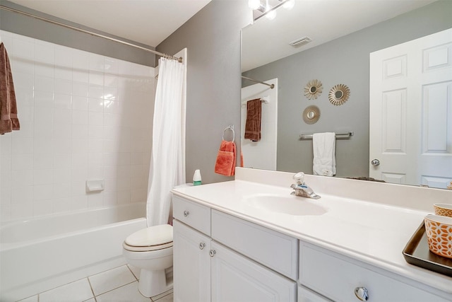 bathroom featuring vanity, visible vents, shower / bath combo, tile patterned floors, and toilet