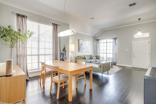 dining space with vaulted ceiling, visible vents, dark wood-style flooring, and ornamental molding