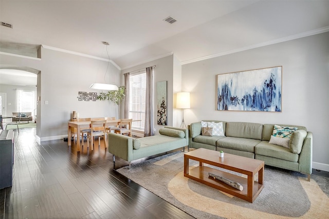 living room featuring arched walkways, visible vents, plenty of natural light, and dark wood-style flooring