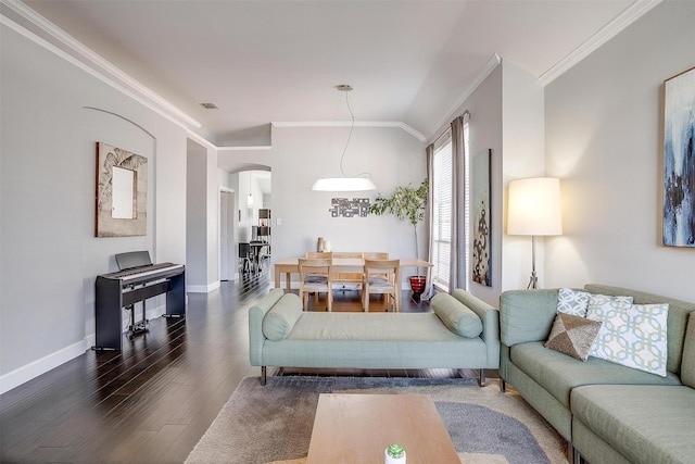 living room with visible vents, ornamental molding, dark wood finished floors, arched walkways, and baseboards