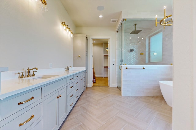 2031 Meadowlark Ct, Aledo, TX 76008 - bathroom featuring a shower stall, a walk in closet, a soaking tub, double vanity, and recessed lighting
