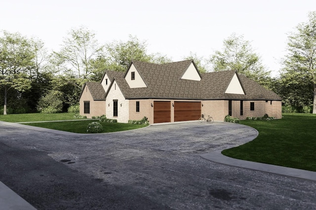 view of front of house with a garage, a front yard, and driveway