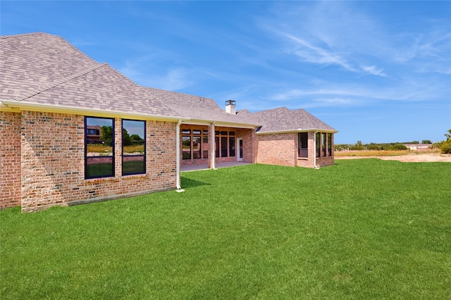 2031 Meadowlark Ct, Aledo, TX 76008 - rear view of property featuring a shingled roof, a yard, and brick siding