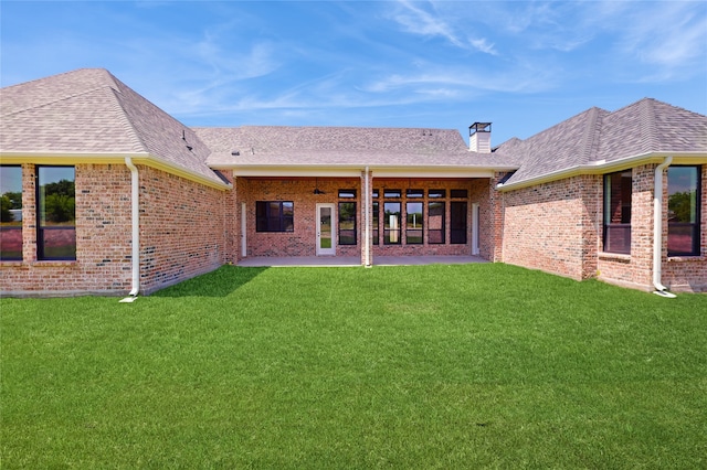 2031 Meadowlark Ct, Aledo, TX 76008 - back of property with a chimney, a lawn, brick siding, and a patio