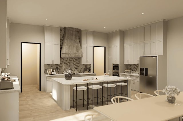 kitchen featuring a kitchen bar, a center island, tasteful backsplash, and stainless steel appliances