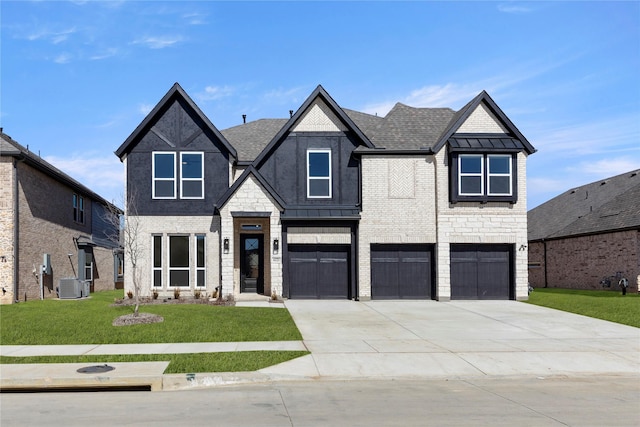 view of front of property featuring brick siding, central AC, a front yard, a garage, and driveway