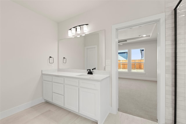 bathroom with baseboards and vanity