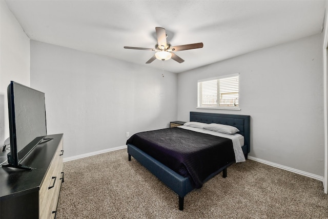 carpeted bedroom with baseboards and ceiling fan