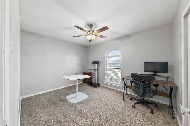 office area with carpet flooring, baseboards, and a ceiling fan