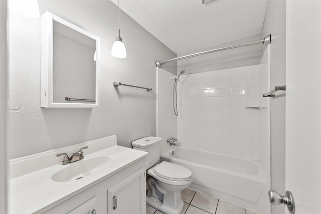 full bathroom featuring vanity, tile patterned floors, toilet, and washtub / shower combination