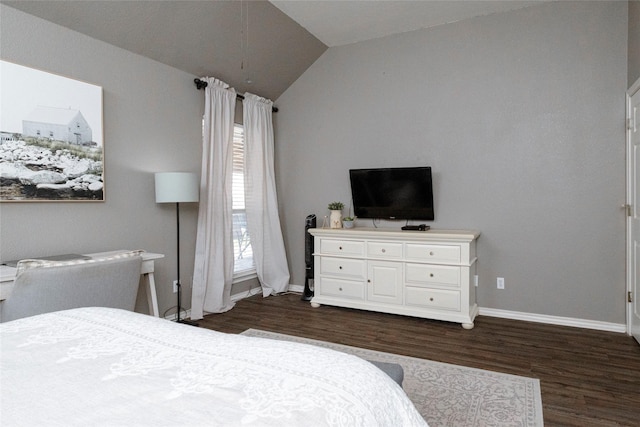 bedroom with baseboards, dark wood-type flooring, and vaulted ceiling