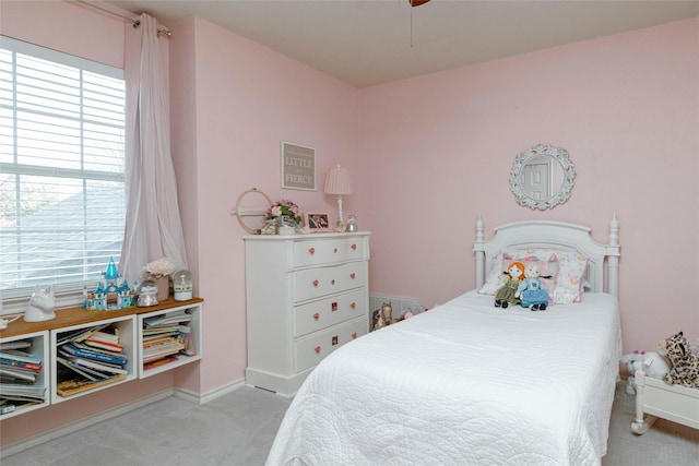 bedroom featuring baseboards, ceiling fan, and carpet flooring