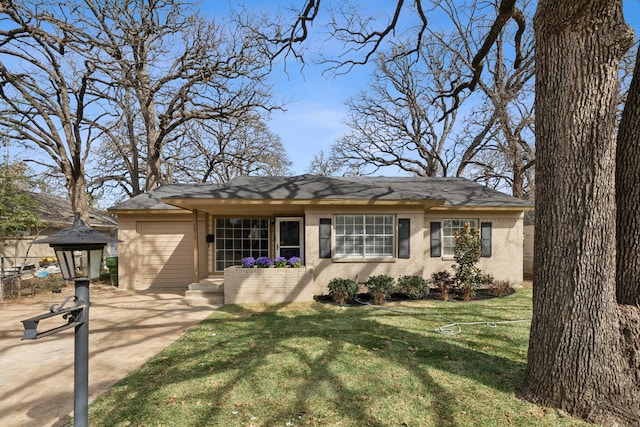 ranch-style house with brick siding, a garage, driveway, and a front yard