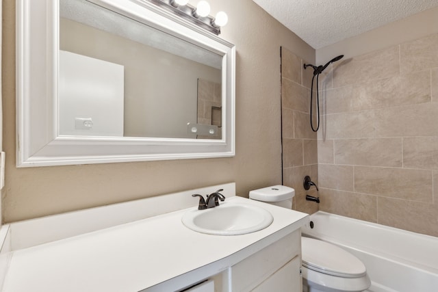 bathroom with a textured ceiling, toilet, vanity, and bathtub / shower combination