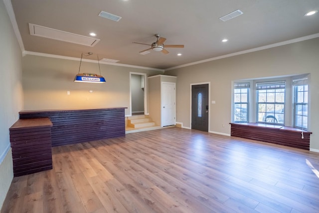 unfurnished living room featuring recessed lighting, attic access, a ceiling fan, and light wood finished floors