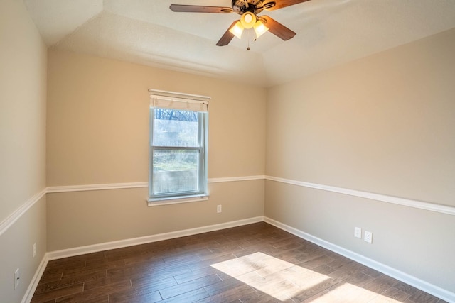 spare room with baseboards, a ceiling fan, and wood finished floors