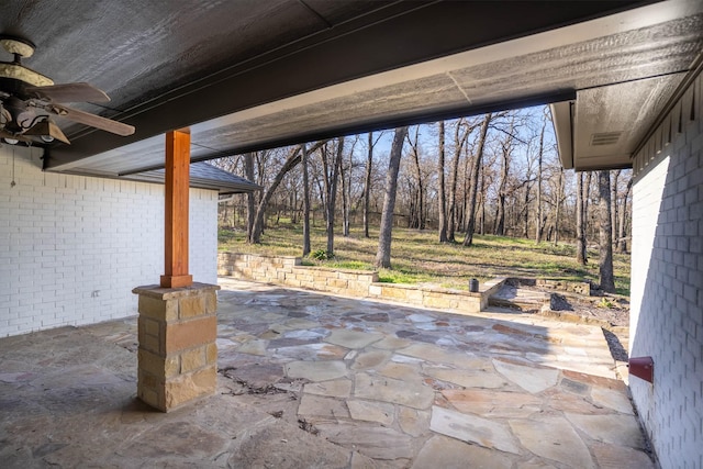 view of patio / terrace featuring ceiling fan