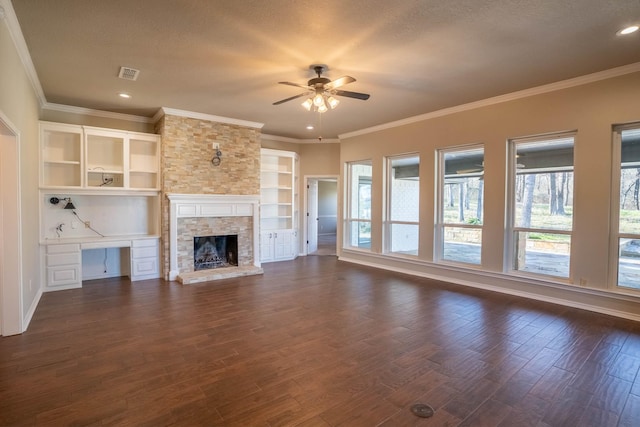 unfurnished living room featuring dark wood finished floors, visible vents, a wealth of natural light, and ceiling fan