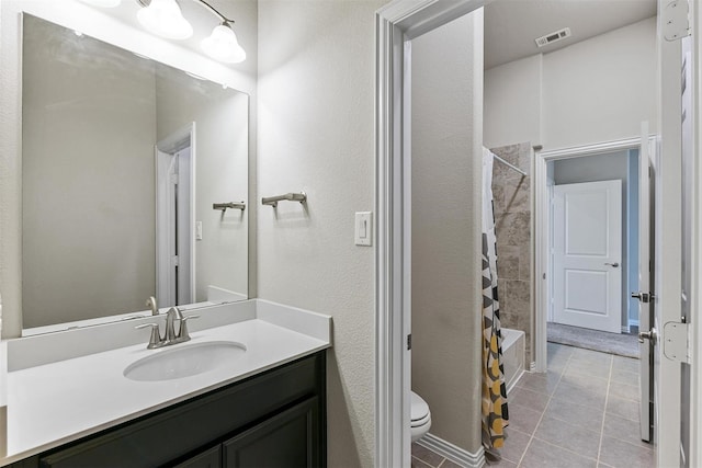 full bathroom featuring vanity, visible vents, shower / bath combo, tile patterned flooring, and toilet