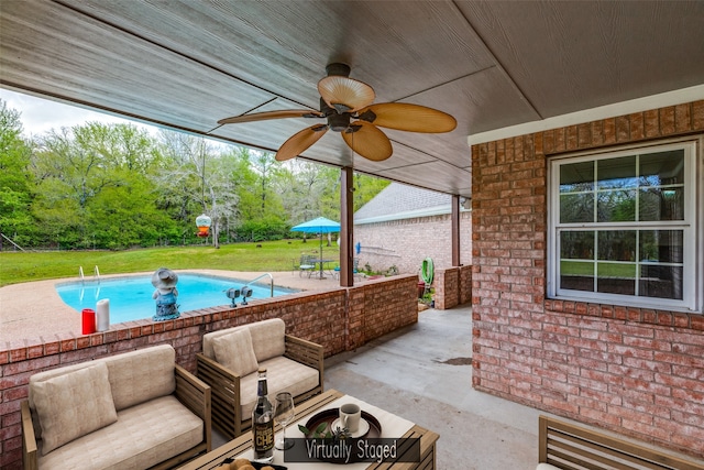 pool featuring a patio area, ceiling fan, an outdoor hangout area, and a yard