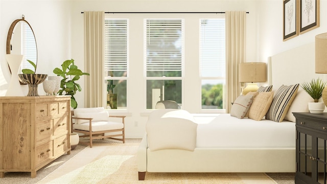 bedroom featuring multiple windows and light colored carpet