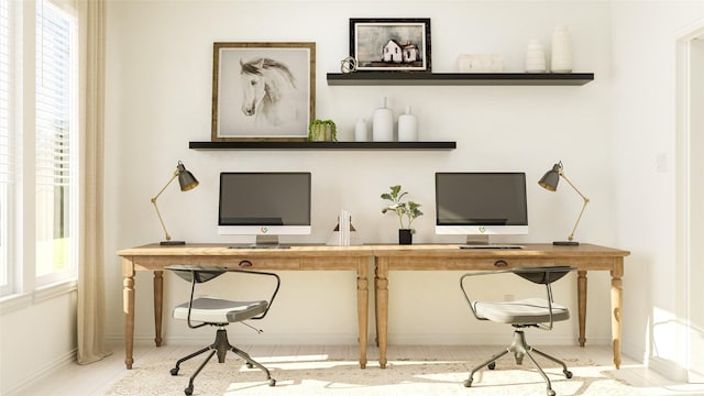 office space with baseboards