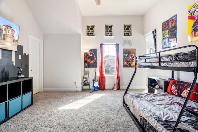 bedroom featuring baseboards and carpet