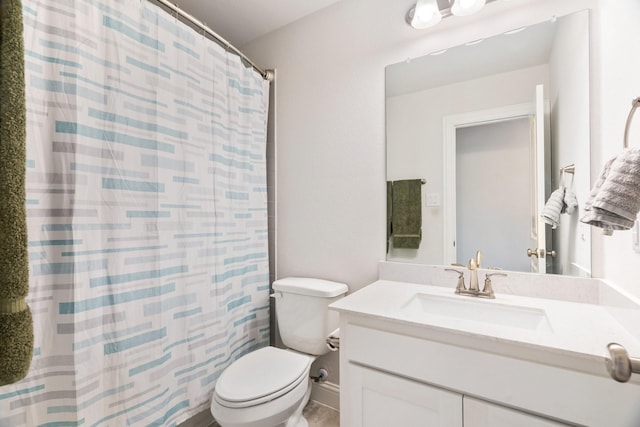 full bath featuring vanity, curtained shower, and toilet