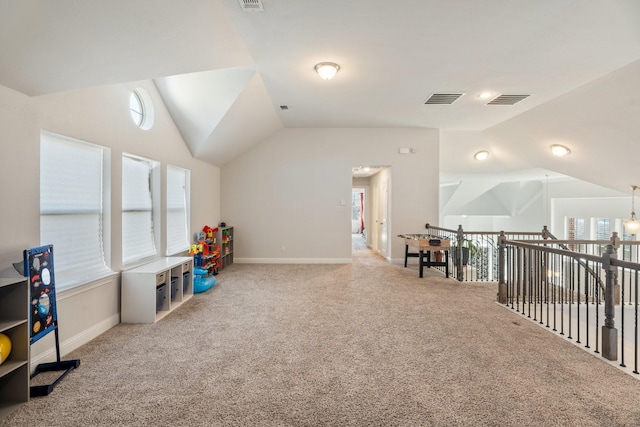 rec room featuring lofted ceiling, carpet, and visible vents