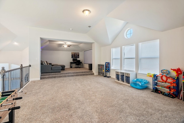 playroom featuring visible vents, baseboards, carpet, lofted ceiling, and ceiling fan