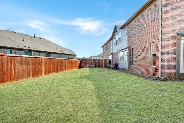 view of yard featuring a fenced backyard