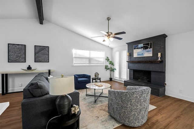 living room with lofted ceiling with beams, wood finished floors, and ceiling fan