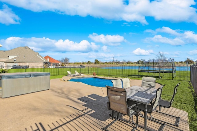 view of pool with a hot tub, outdoor dining area, a fenced backyard, a yard, and a patio area